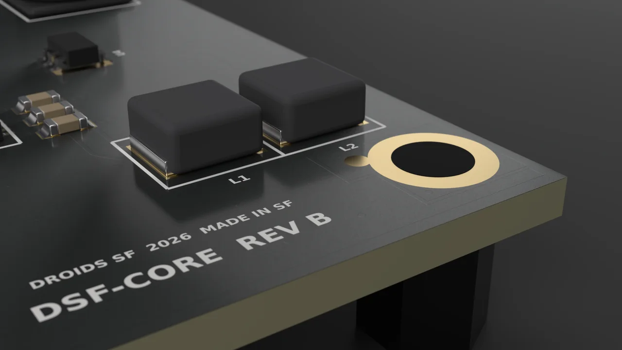 Corner of the board with a plated mounting hole, power inductors and silkscreen